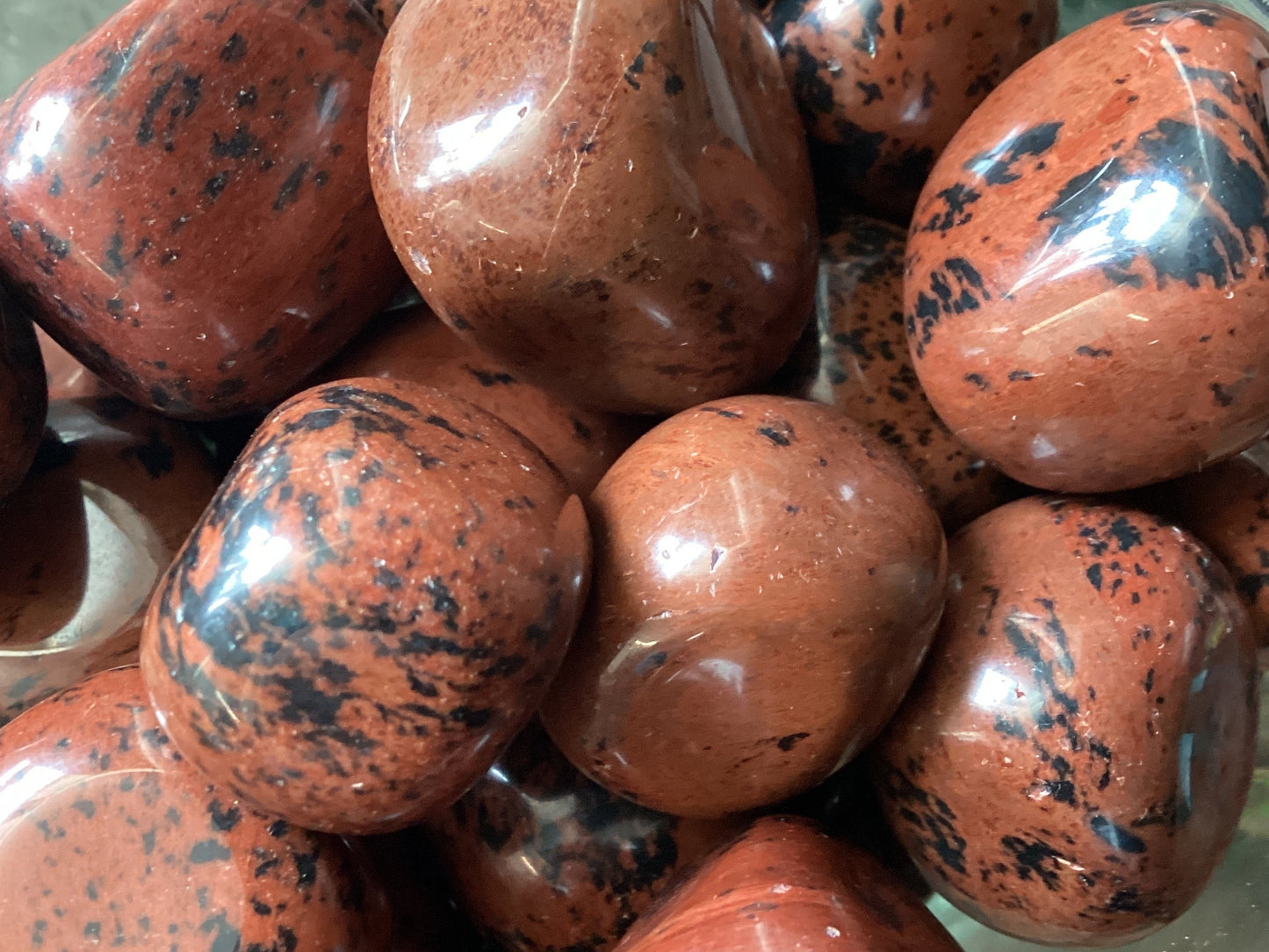 Red Obsidian, also known as Mahogany Obsidian, is a grounding and protective stone connected to the root chakra. It