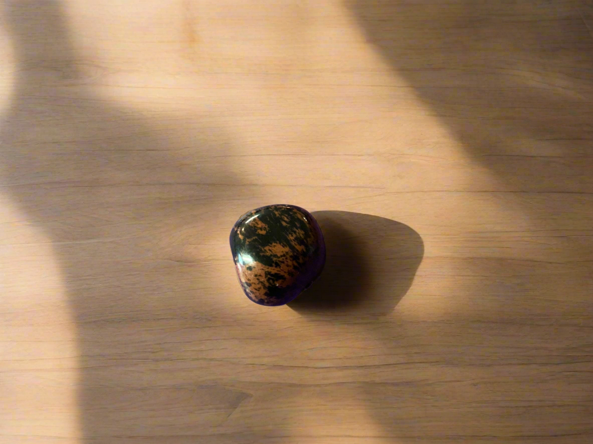 Red Obsidian, also known as Mahogany Obsidian, is a grounding and protective stone connected to the root chakra. It