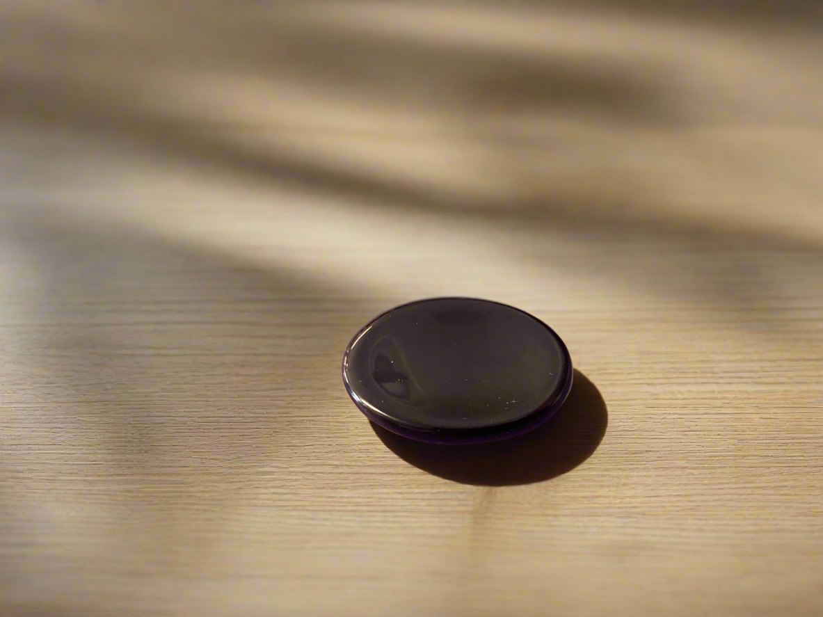 This worry stone, carved from the beloved black obsidian, follows the traditions born in Ancient Greece. 