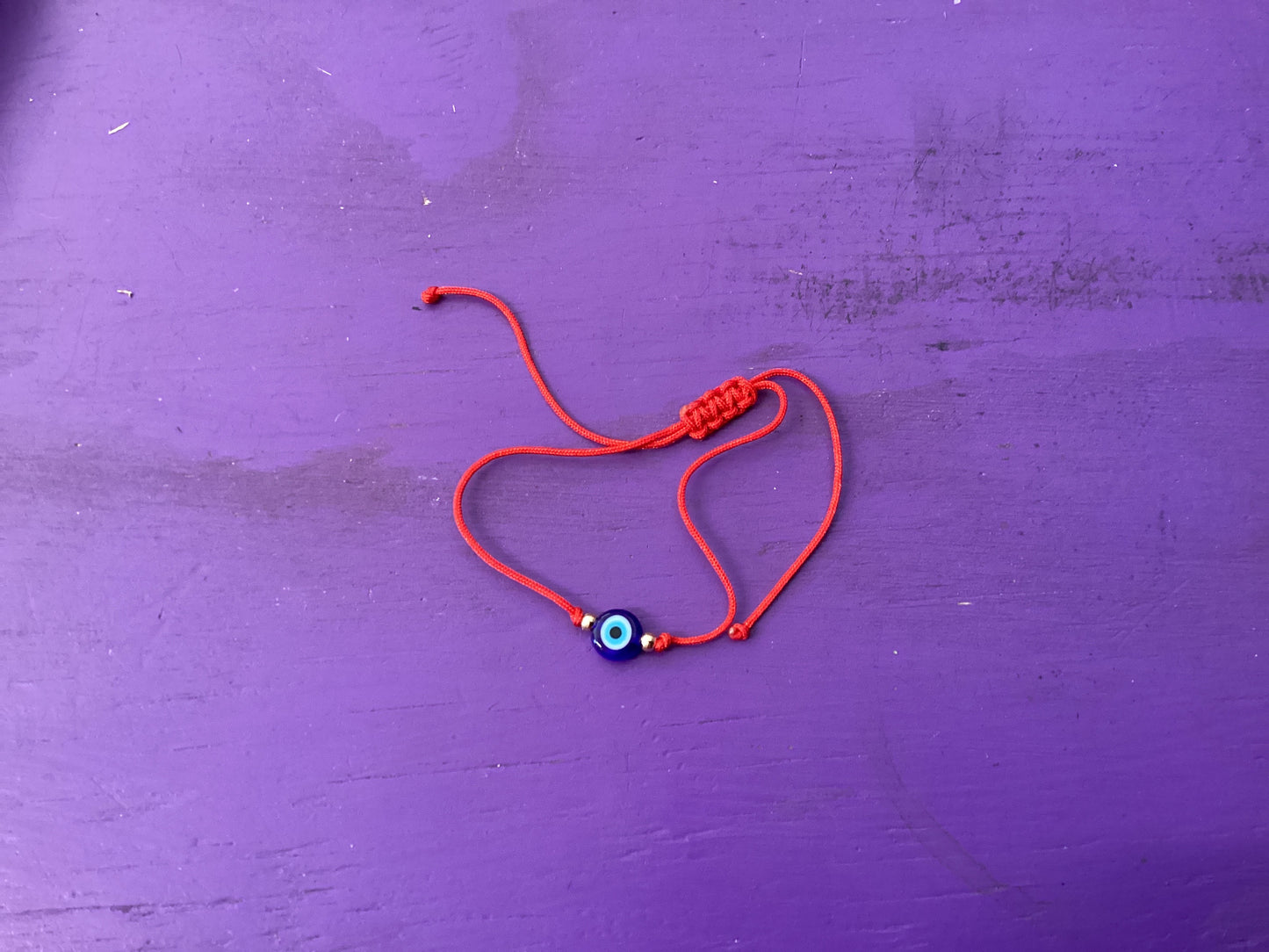 Evil eye jewelry and talismans are designed to ward off the evil eye and evil that has been directed at a person. The evil eye symbol protects and gives power against evil spirits or bad luck.

Bracelet available in red or black. Buyer will receive one hand selected bracelet.