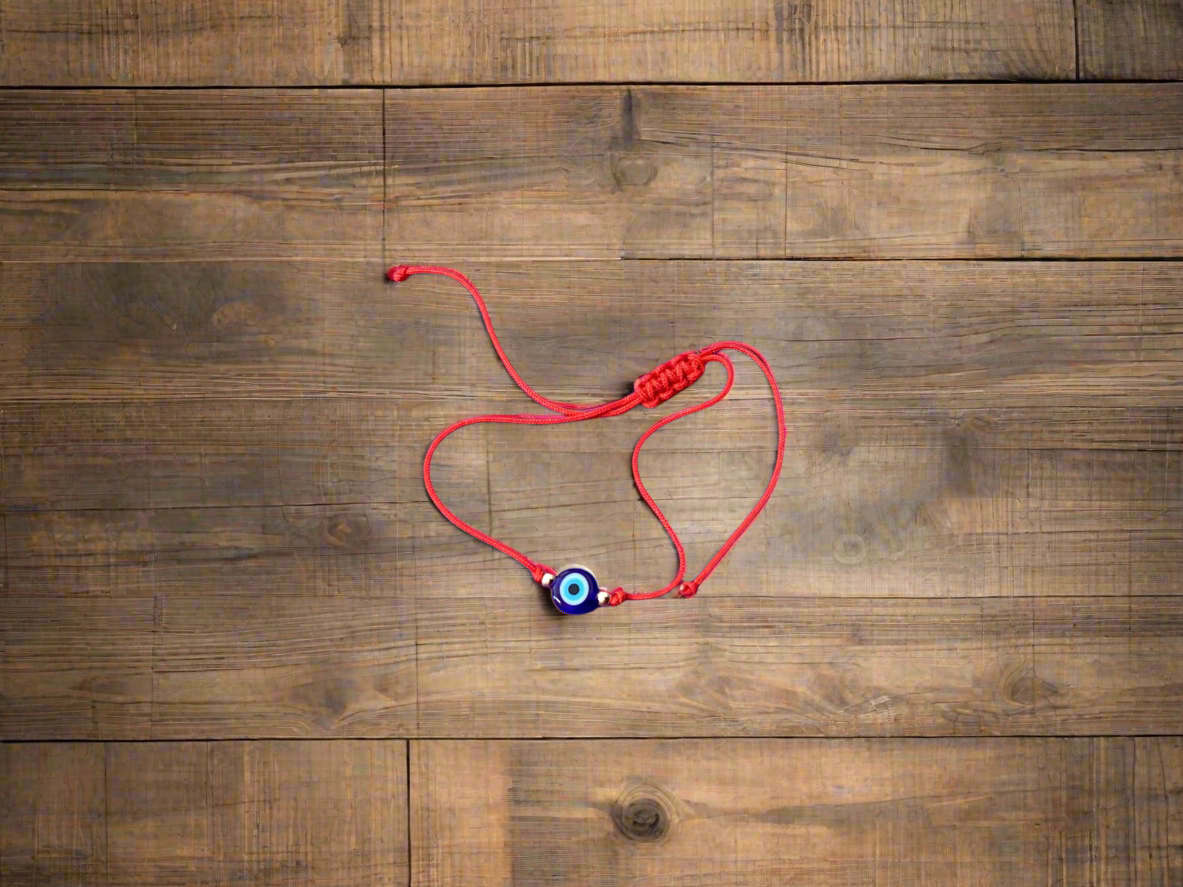 Evil eye jewelry and talismans are designed to ward off the evil eye and evil that has been directed at a person. The evil eye symbol protects and gives power against evil spirits or bad luck.

Bracelet available in red or black. Buyer will receive one hand selected bracelet.